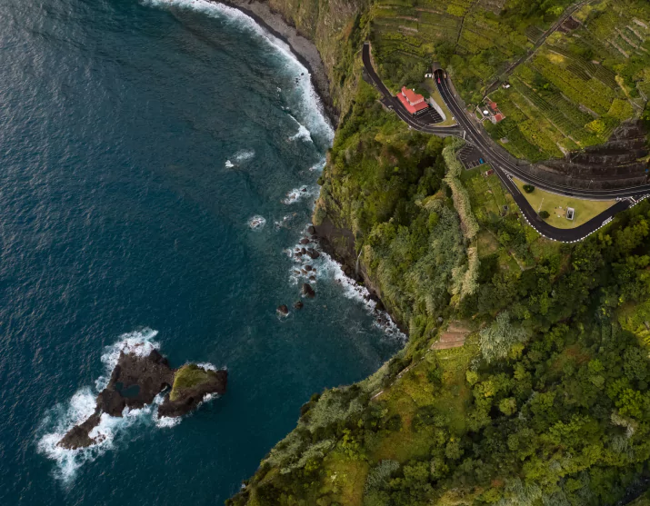 Road and house on cliff near sea